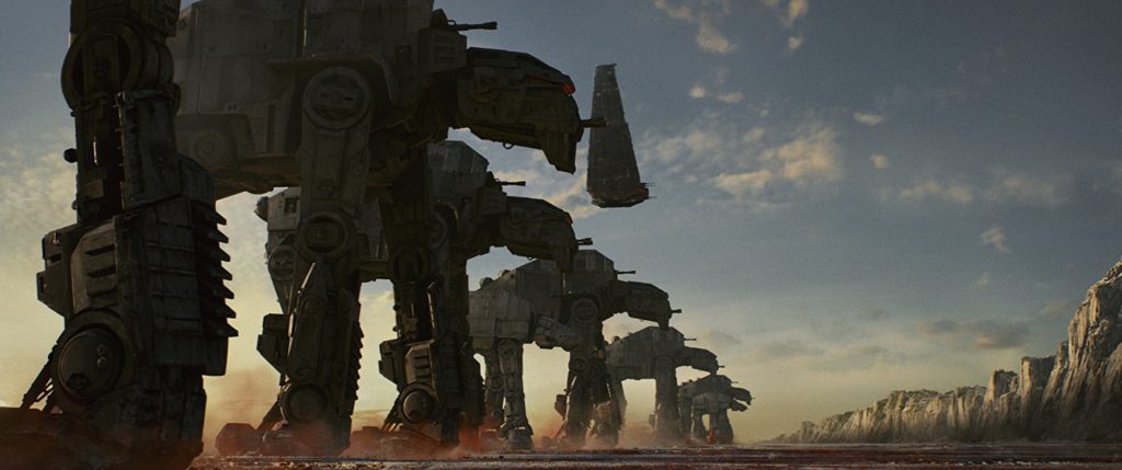 Vários AT-AT alinhados, com uma nave imperial acima deles