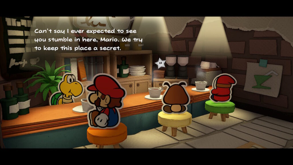 Mario senta numa loja de café que possui uma iluminação intimista com uma xícara à sua frente