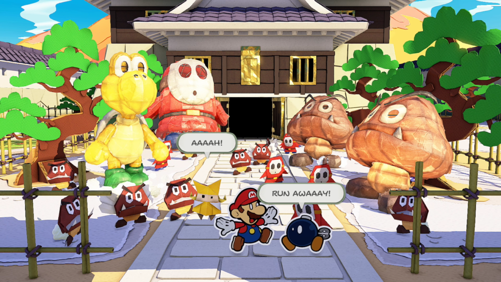 Imagem em que Mario em primeiro plano foge de vários inimigos, em cena do jogo Paper Mario: The Origami King