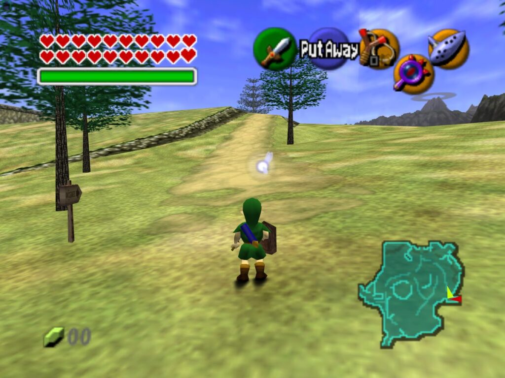 Imagem capturada do jogo the legend of zelda o ocarina of time. Nela, link (criança) está nos campos de hyrule, próximo à saida da floresta Kokiri. Ele está com espada e escudo em mãos, virado na direção da estrada, que é ladeada por algumas árvores. Ao fundo, na direita, vemos a Montanha da Morte. A interface Gráfica do jogo está visivel, mostrando todos os corações liberados e completos, o mapa, o dinheiro (0 rupees), e os itens equipados: estilingue, lentes da verdade, e a Ocarina