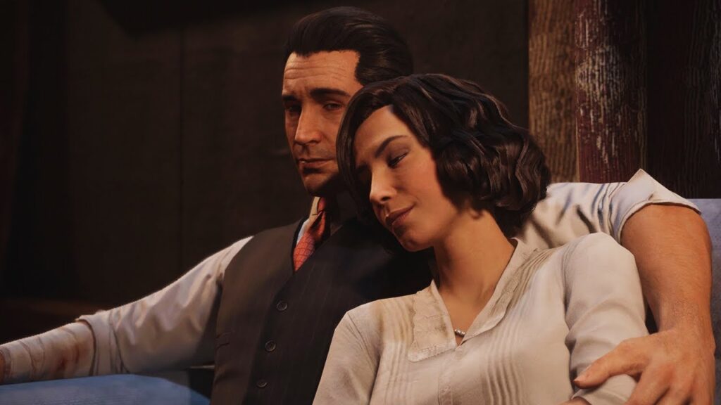 Tommy e Sarah sentados no sofá juntos em Mafia Definitive Edition