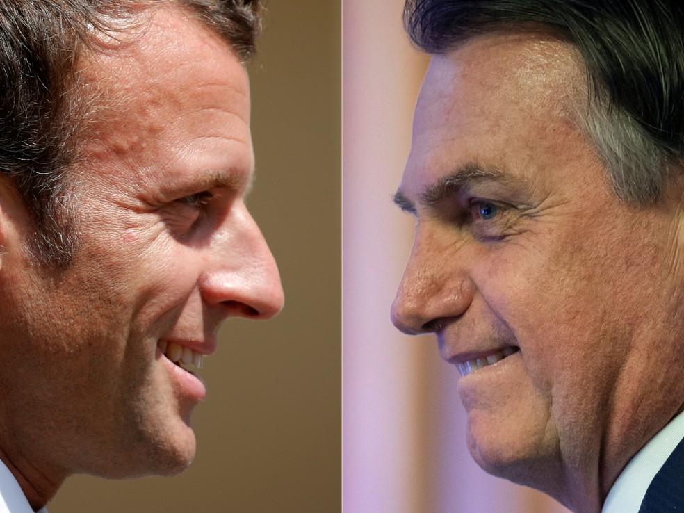 Do lado esquerdo, Macron em close. Foto em perfil com ele virado para a direita. 
Na direita, foto em perfil de Bolsonaro, que está olhando para a esquerda. 
