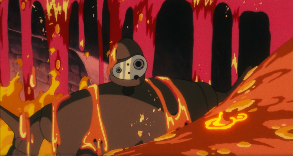 um dos robôs de Laputa. está envolto em ferro flamejante, que lembra magma